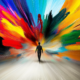 A vibrant, abstract digital illustration of a person walking towards an explosion of colors, symbolizing endless creative possibilities. The figure is silhouetted against a dynamic burst of blues, reds, yellows, and greens, creating a sense of motion and expansion. The vivid colors spread outwards, evoking inspiration, imagination, and the journey into the unknown. The overall mood is uplifting and emphasizes creativity and exploration.